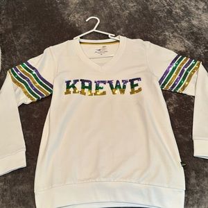 Brand new Mardi Gras top that says KREWE in sequins.